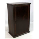 A mahogany table top cabinet, the crossbanded single door enclosing single shelf, 49 x 31cm.