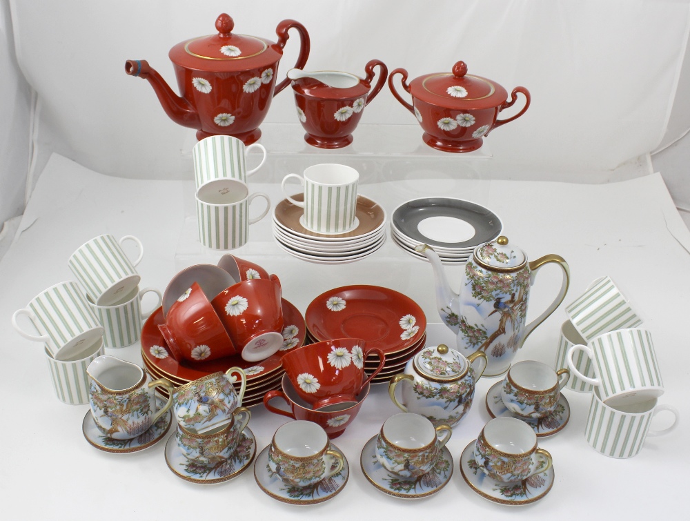 A Noritake six-setting tea service decorated in the daisy pattern to a red ground (af),
