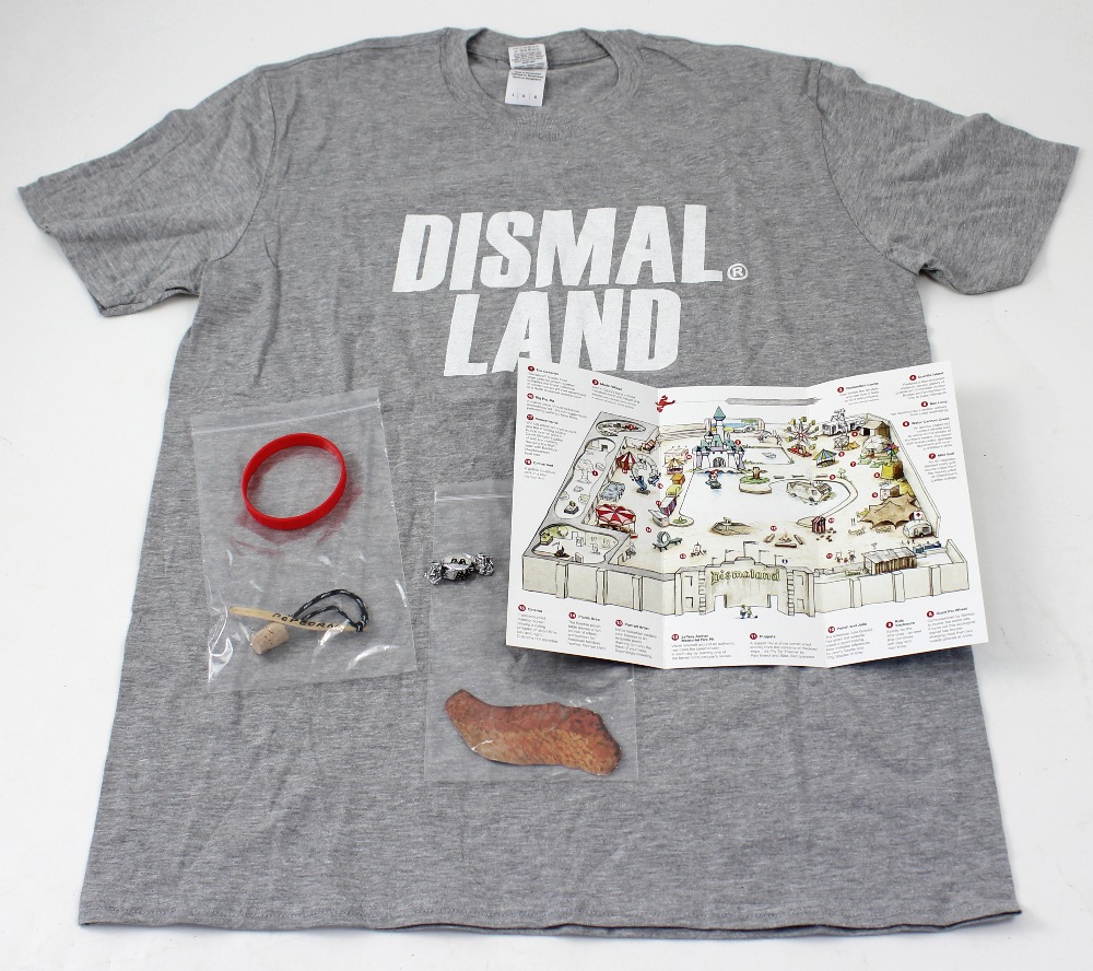 A small collection of Banksy's 'Dismaland' items to include 'Dismaland Bemusement Park' programme,