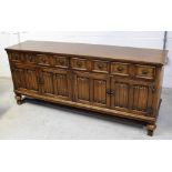 An early to mid 20th century oak priory style sideboard,