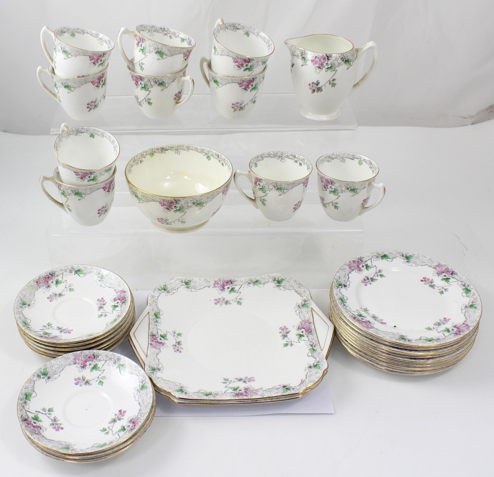 A mid 20th century Shelley ten setting tea service in Dog Rose pattern in pinks and greens,