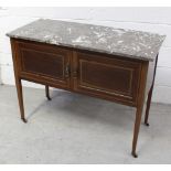An Edwardian mahogany washstand with grey marble top surmounting two-door cupboard base,