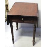 A Victorian mahogany drop leaf side table with single frieze drawer supported on turned legs to