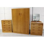 A 1960s solid oak bedroom suite comprising a four drawer dressing chest,