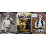 Four original Banksy posters from the Banksy exhibition 'Banksy vs Bristol Museum' dated June