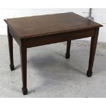 A 1920s mahogany Arts and Crafts library table on square tapering legs to spade feet, length 108cm,