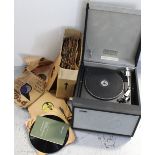 A Hacker portable record player and a collection of 78rpm records.