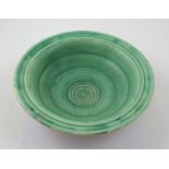 A green Art Deco style ceramic bowl, impressed mark to base, 'H.O Made in England'.