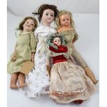 A collection of dolls to include an English bisque head doll marked DRC161G to the back of the head,