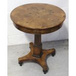 A William IV walnut drum table with quarter-matched veneered walnut top surmounting three frieze