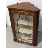 A good 20th century Victorian revival mahogany corner cupboard with single astragal glazed door