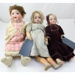 A small assortment of bisque head dolls to include an Armand Marseille 390, an Armand Marseille 991,