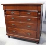 A Victorian mahogany Scotch chest with hidden frieze drawer surmounting a two-over-three drawer