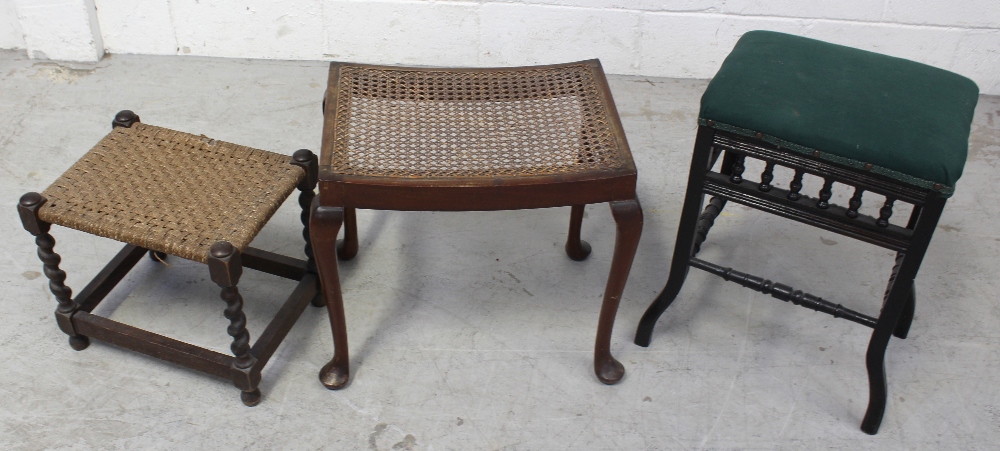 An Edwardian upholstered dressing stool, an oak barleytwist stool, and a cane seated stool (3).