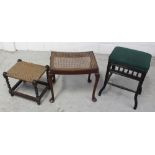 An Edwardian upholstered dressing stool, an oak barleytwist stool, and a cane seated stool (3).