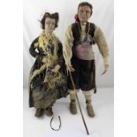 A pair of late 19th century Spanish composite dolls in period dress,