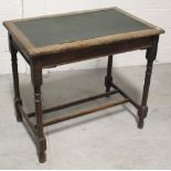 An early 20th century oak rectangular side table with lined top and turned supports, 85 x 55cm.