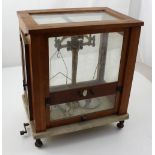 A case set of Paul Bunge scientific balance scales with marble platform base, height 44cm.