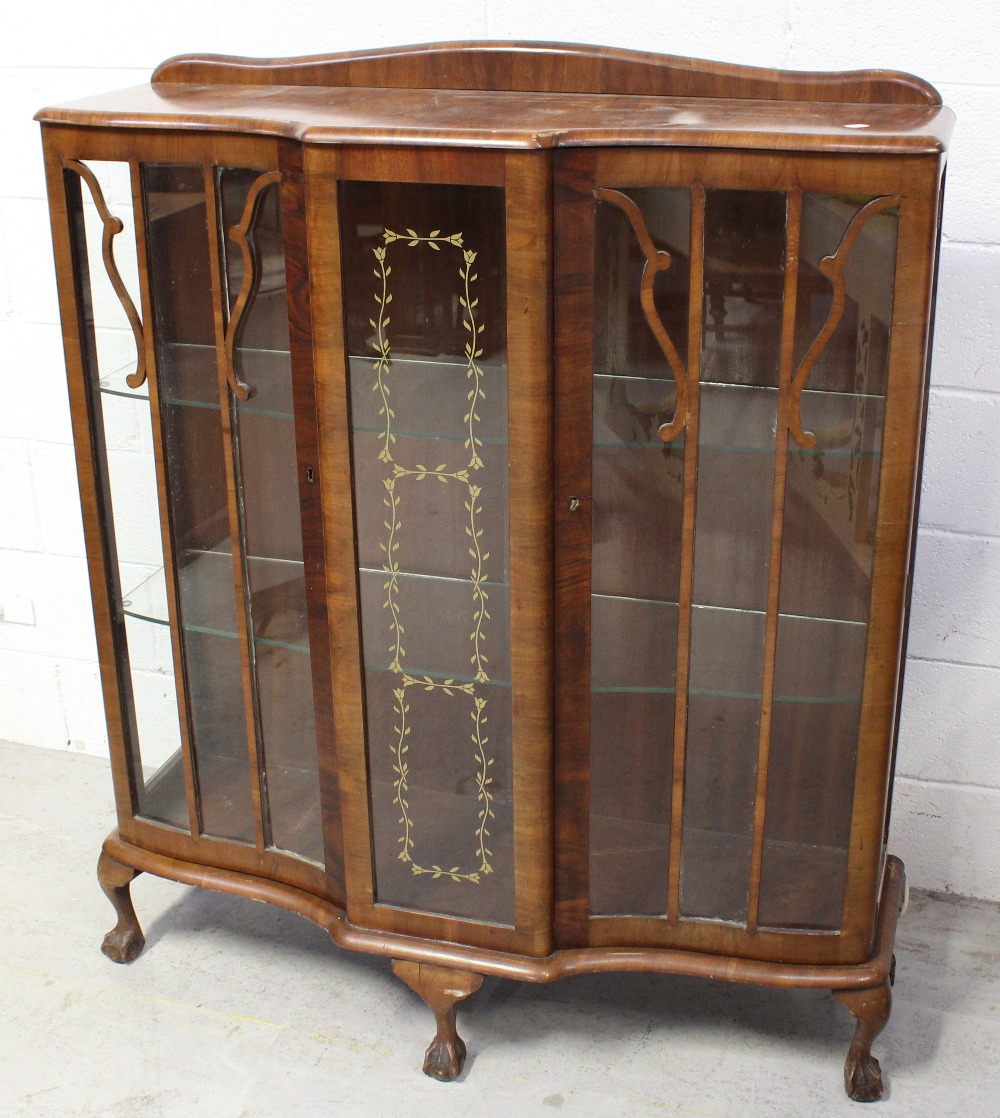 An early 20th century walnut glazed display cabinet on claw and ball supports, width 105cm.