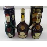 A bottle of Benedictine liqueur in original blue metal tin and two bottles of Benedictine and