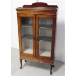 An early 20th century mahogany glazed display case raised on cabriole supports, width 72.5cm.