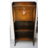An early 20th century oak students' bureau fitted with pigeonholes and on a single shelf base,