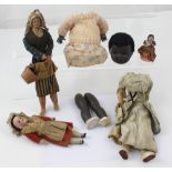 A small collection of vintage bisque head and composite dolls to include a 1950s black doll in