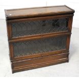 An oak two-tier Globe Wernicke stacking bookcase with leaded glass doors, height 81.5cm.