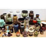 A collection of predominantly West German pottery to include a pair of white ground vases,