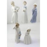 Five Lladró Nao figures to include boy in nightgown with fly swat,