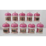 Fifteen French pink finish ceramic apothecary jars with impressed marks 'Y G & Co' to the base,