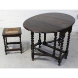 An early 20th century oak barleytwist gate leg table, length when extended 108cm,