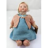 An early 20th century Armand Marseille doll, bisque head with fixed blue eyes and closed mouth,