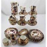 A quantity of 19th century Crown Derby Imari pattern porcelain to include twelve cups,