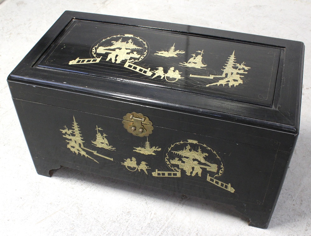 A Chinese brass inlaid camphorwood bedding box with hinged lid, width 90cm.