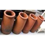 Four terracotta chimney pots, height 64cm (4).