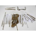 A collection of vintage stainless steel surgical and proctology apparatus to include clamps, hooks,