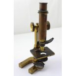 A mahogany cased R & J Peck London microscope.