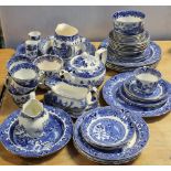 A collection of Burleigh ware blue and white willow pattern ceramics,