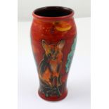 A signed Anita Harris red ground baluster vase hand painted with a fox, height 17cm.