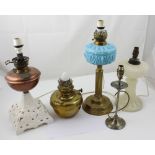 Four converted paraffin lamps to include a latte glass alabaster effect example,