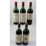 Five assorted bottles of red wine to include two bottles of 1973 Chateau Mouton Baron Philippe