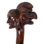 A Victorian staff with finial modelled as Punch and Judy, length 110cm, reduced in length (af).