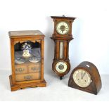 An early 20th century oak smoker's cabinet with ceramic jar and pair of dishes,