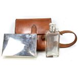 A leather cased flask and hinged sandwich tin (strap af).