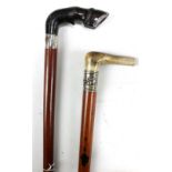 A Victorian malacca shafted hallmarked silver mounted walking stick with horn handle modelled as a