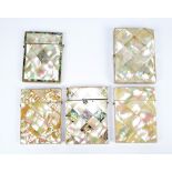 Five Victorian mother of pearl card cases, one with silk lined compartmentalised interior,