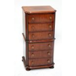 A Victorian mahogany miniature chest on chest of bowfronted outline,