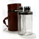 A leather cased three part spirit flask set.