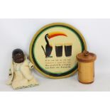 A Guinness Toucan advertising tray, a German manufacture black doll,